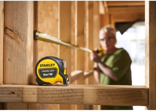 Рулетка вимірювальна CONTROL-LOCK довжиною 5 м/16, шириною 25 мм, в обгумованому корпусі, з подвійною шкалою STANLEY STHT37235-5